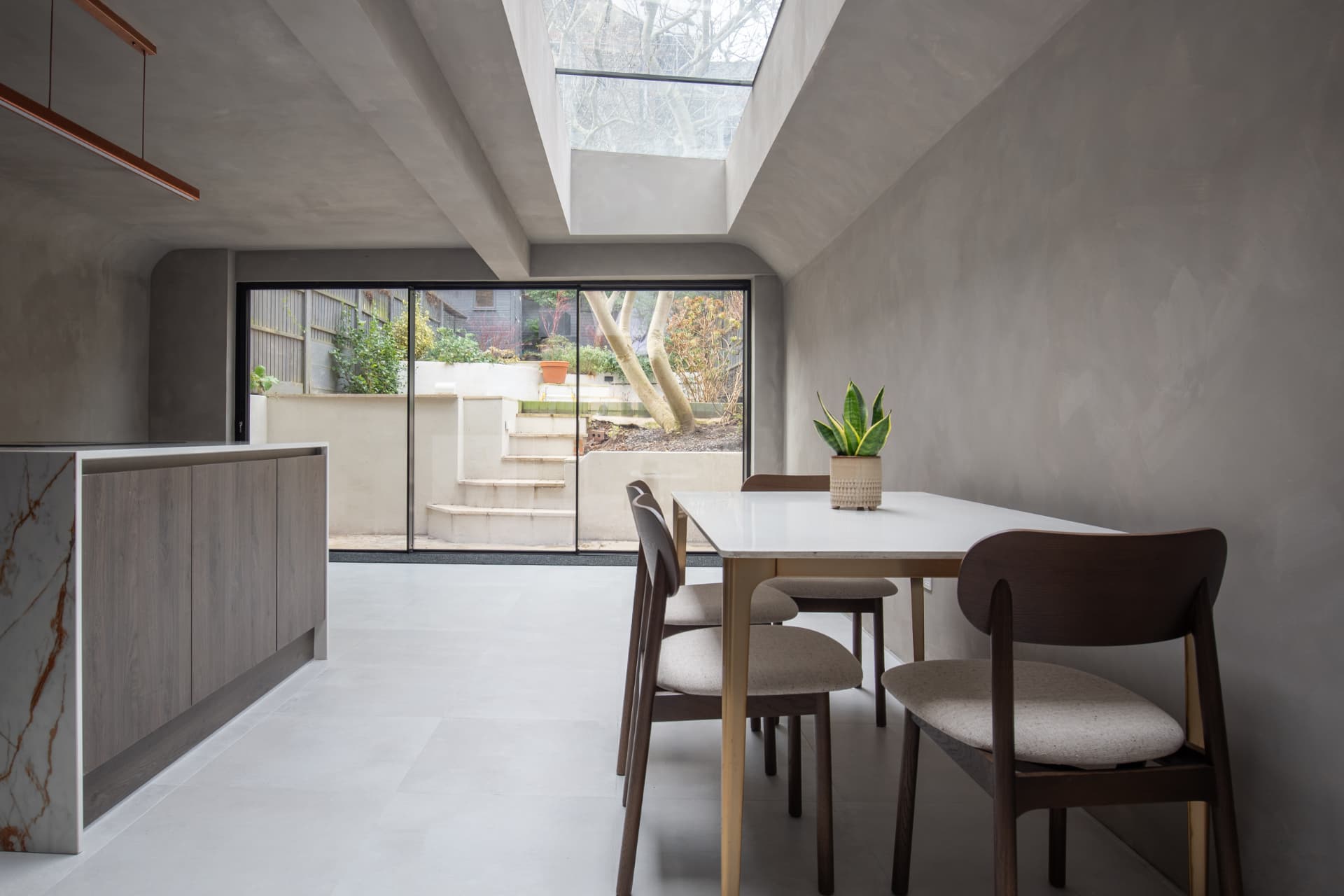 Dining area looking out to the garden under a skylight