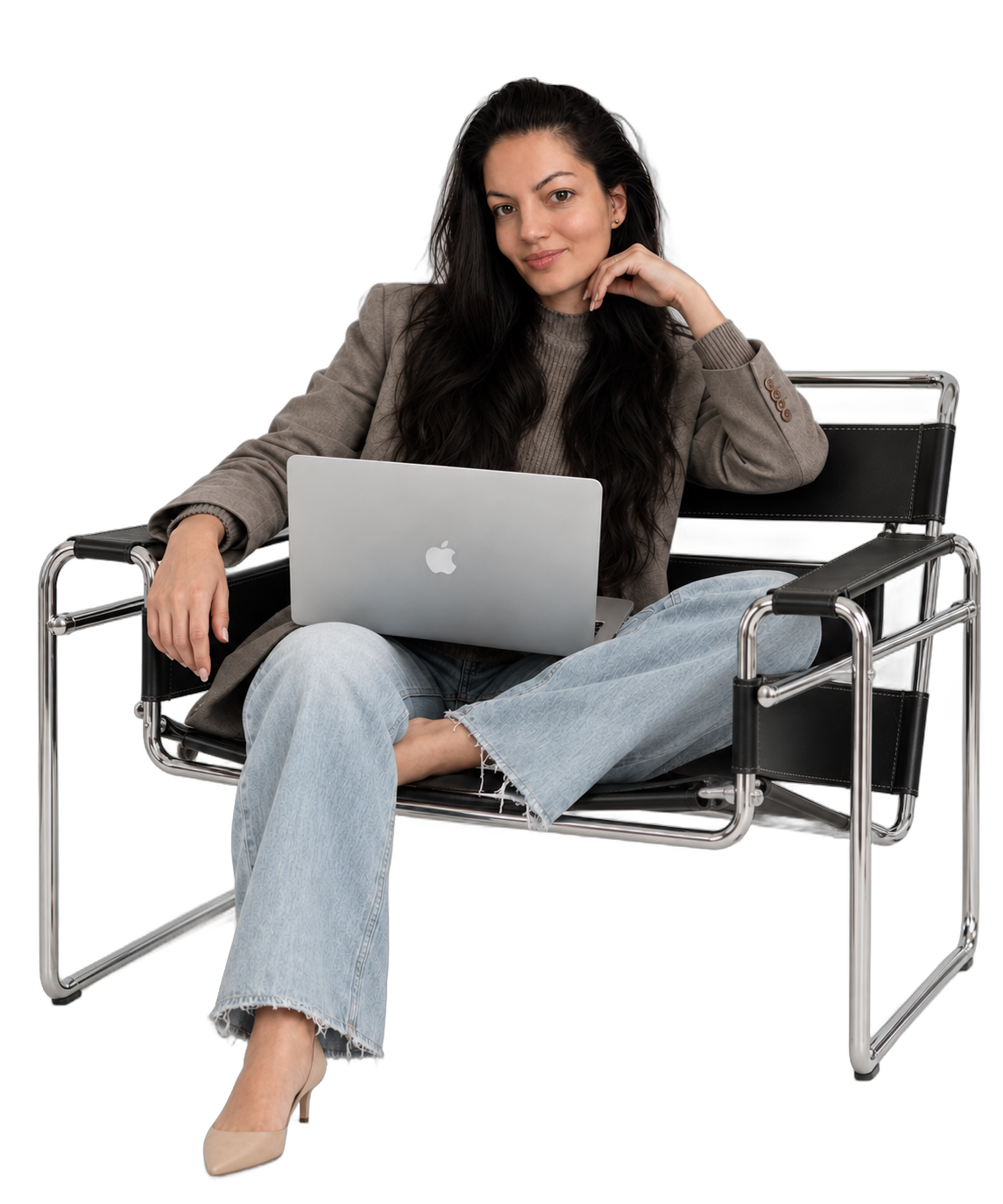 Renata Szabo seated with a laptop at SABO Studio